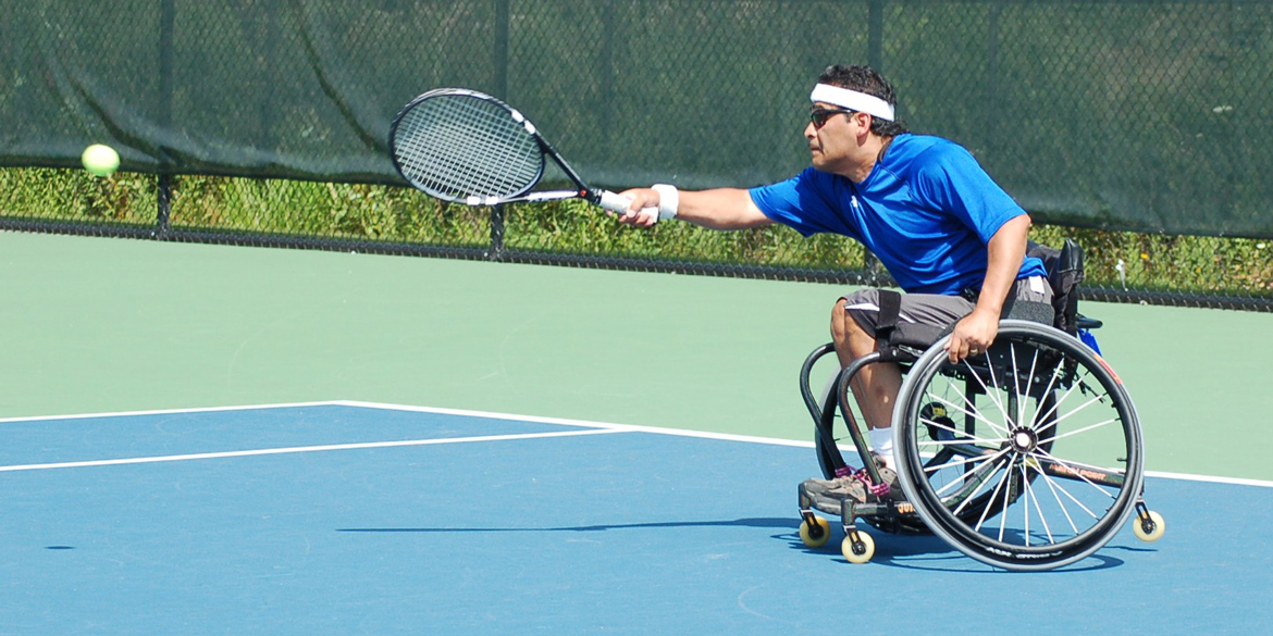 Wheelchair athlete playing tennis Wheelchair athlete playing tennis