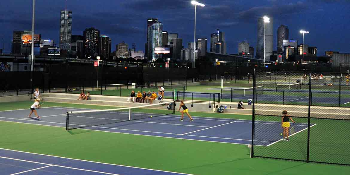Ariel view of tennis court while woman's match is in play.