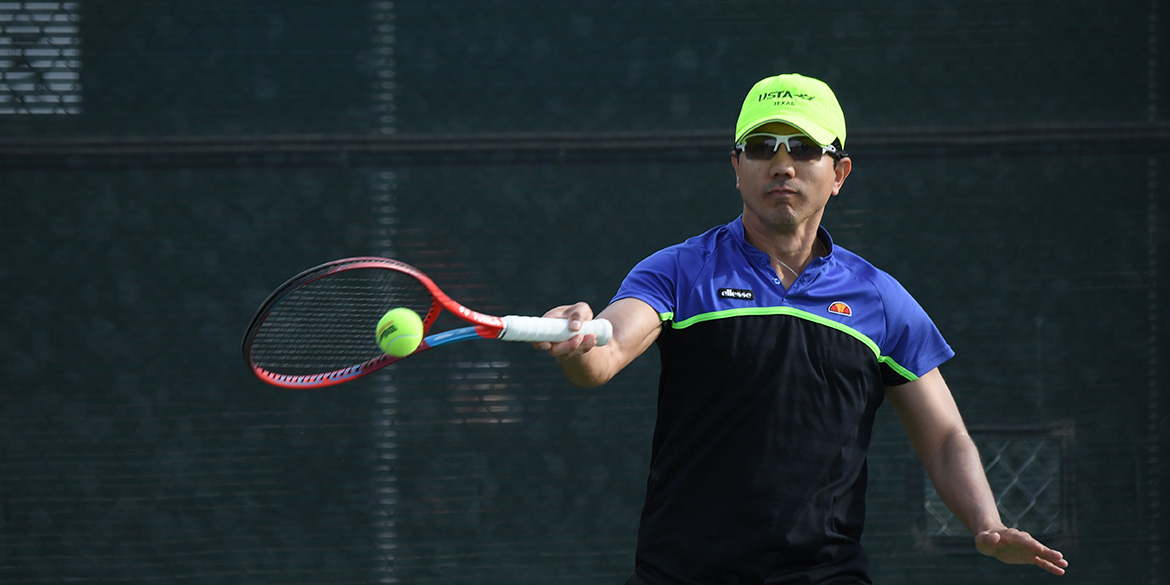 Texas tournament player hitting a forehand