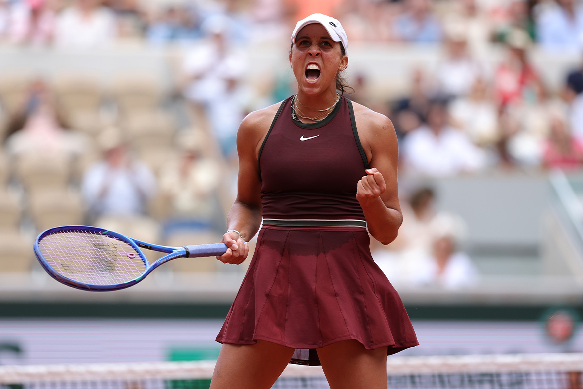Female tennis player celebrating win at 2025 Roland Garros.