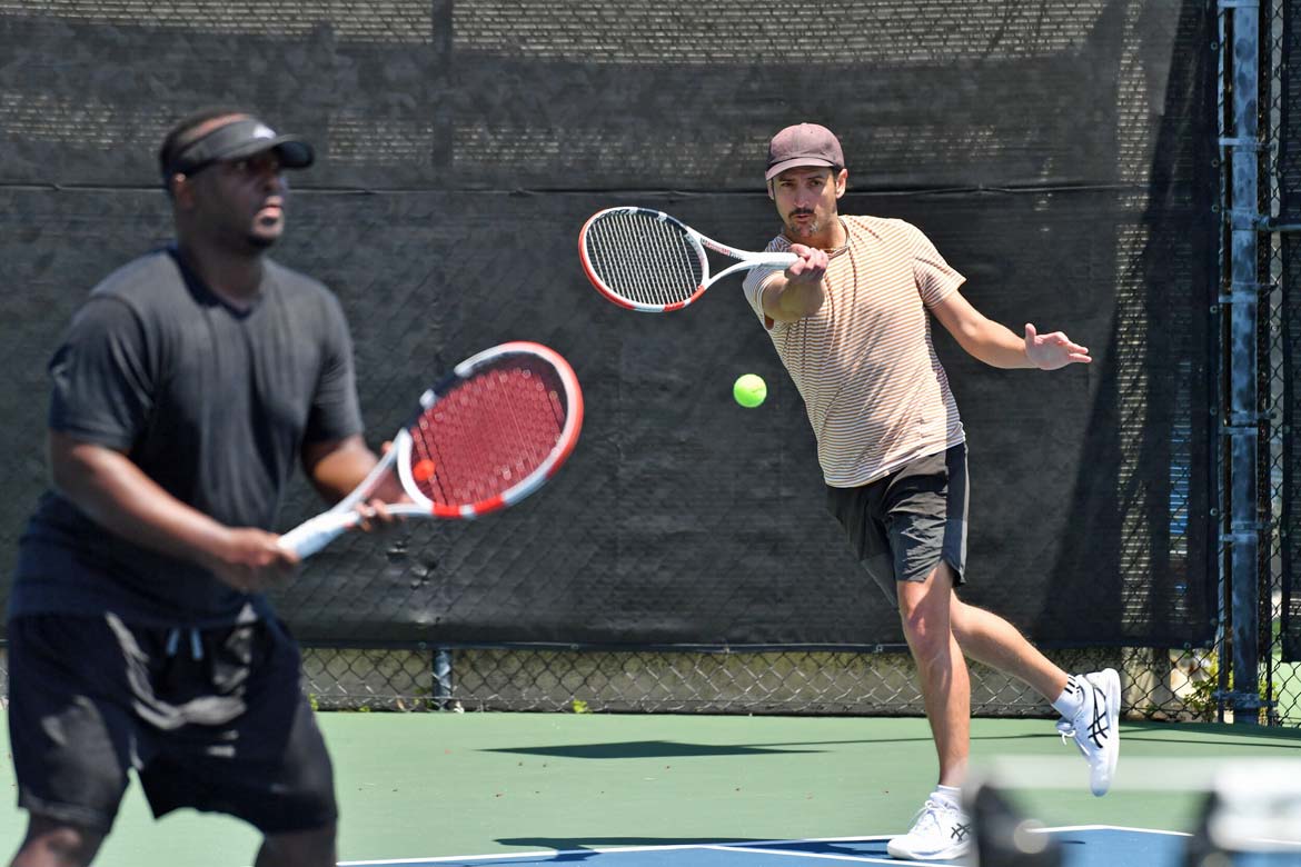 Doubles tennis action. Photo by Juan Ocampo/USTA.