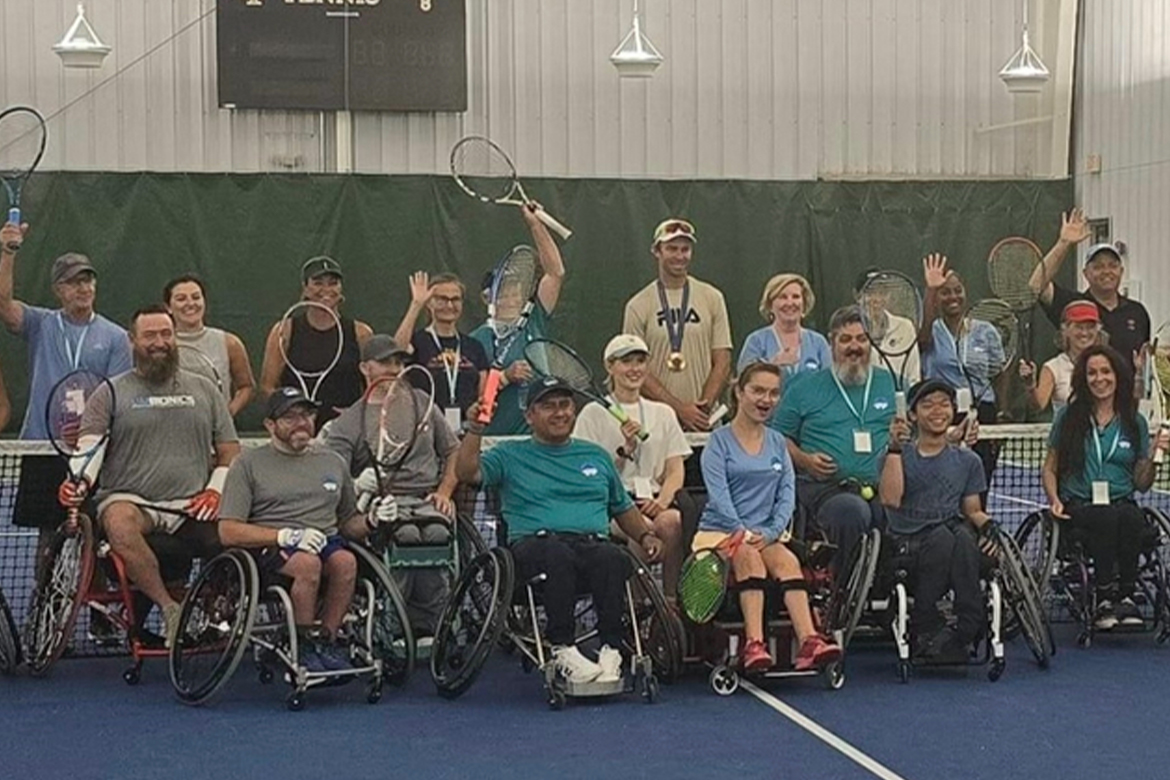 Tennis players pose for a photo.